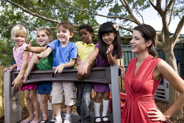 Woman standing next to children